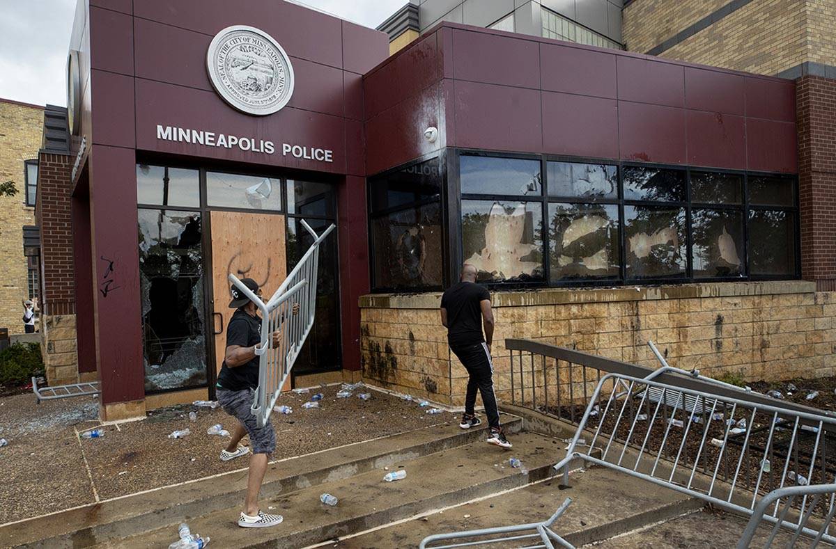 Protesters damage properties at the Minneapolis 3rd Police Precinct in Minneapolis on Wednesday ...