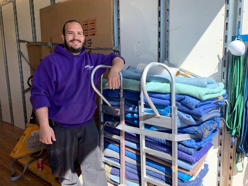 Carlos Ibarra, Move 4 Less team member, is ready to help four local families through the compan ...