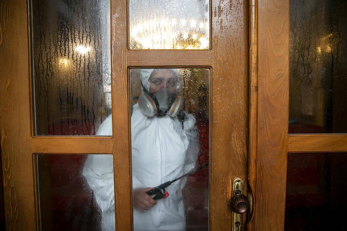 Disinfection team disinfect the premises of the grand mosque in capital Pristina, Kosovo on Thu ...