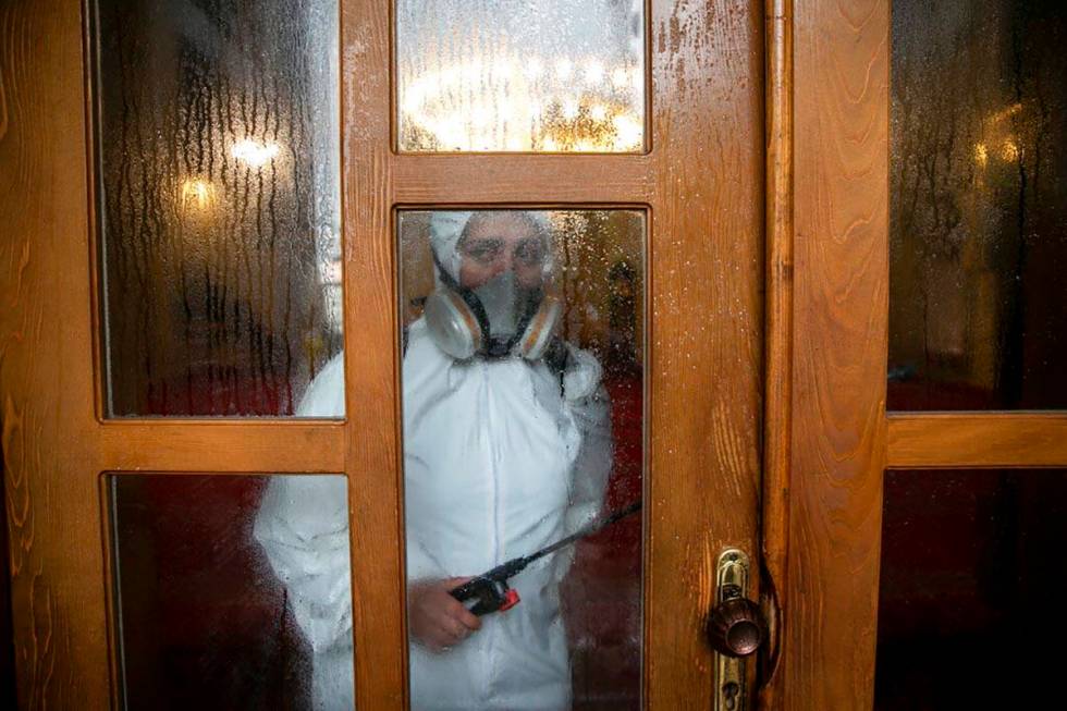 Disinfection team disinfect the premises of the grand mosque in capital Pristina, Kosovo on Thu ...