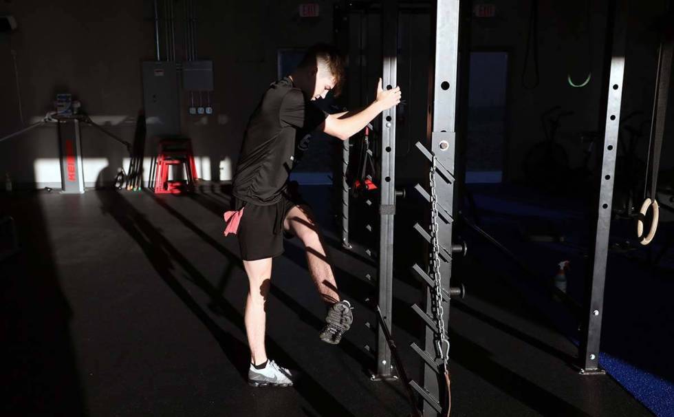 Ethan Ryan, 17, partakes in strength training while following social distancing guidelines at T ...