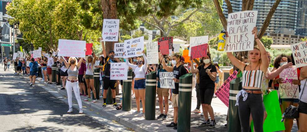 Protestors line the street near the Bellagio Fountains during a Black Lives Matter protest and ...