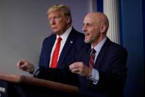 President Donald Trump, left, listens as Food and Drug Administration Commissioner Dr. Stephen ...