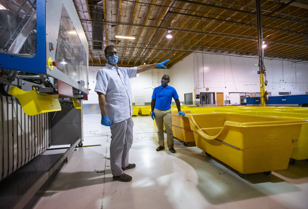 Nathan Faris, general manager at Western Linen Services, left, and Alex Dixon, west region pres ...