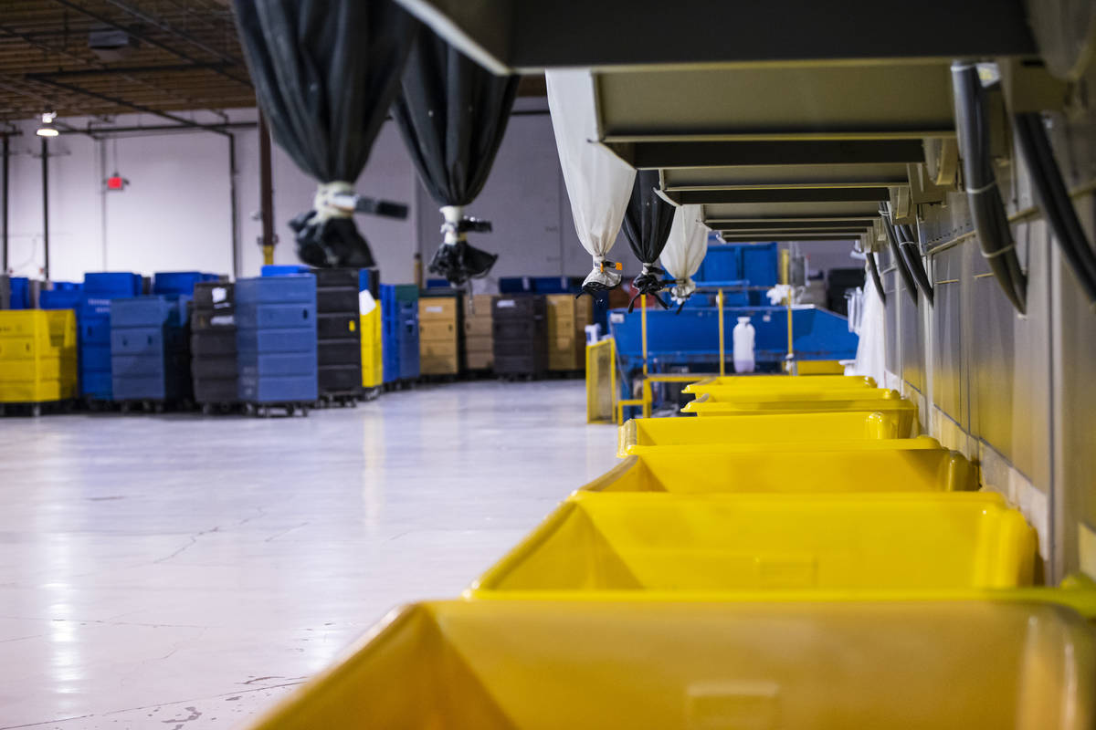 Bins await dried clothing and linens at the Western Linen Services laundry facility in Las Vega ...