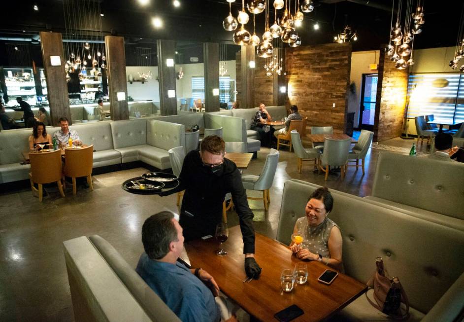 David and Lisa French, bottom, enjoy dinner at Partage on Wednesday, May 27, 2020, in Las Vegas ...