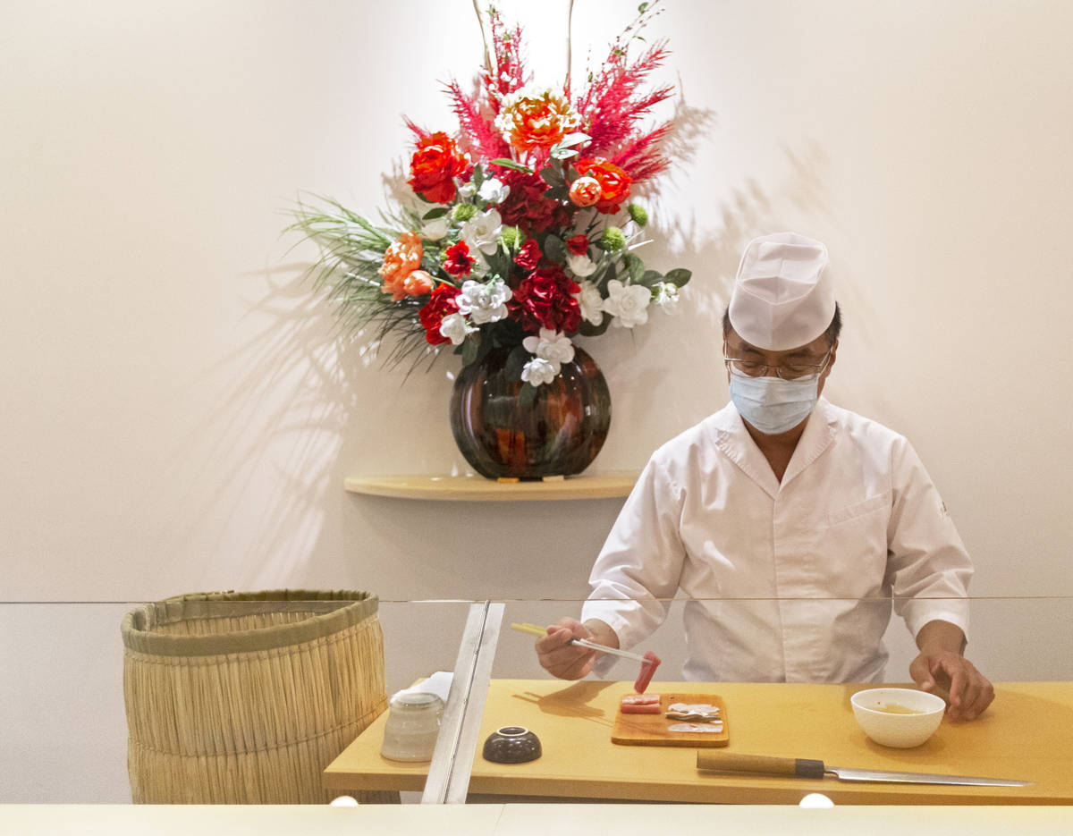 Executive chef Kaz Iida prepares sushi at Yui Edomae Sushi on Thursday, May 28, 2020, in Las Ve ...