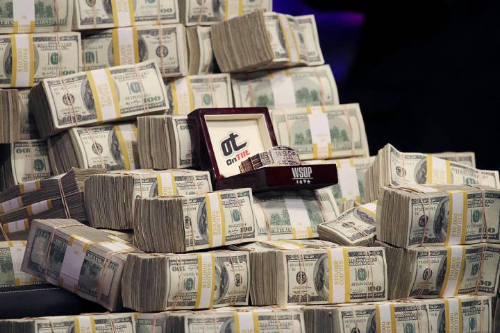 The 2011 WSOP Championship Bracelet is displayed along with bundles of cash during the World Se ...