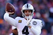 Oakland Raiders quarterback Derek Carr throws a pass during the first half of an NFL football g ...