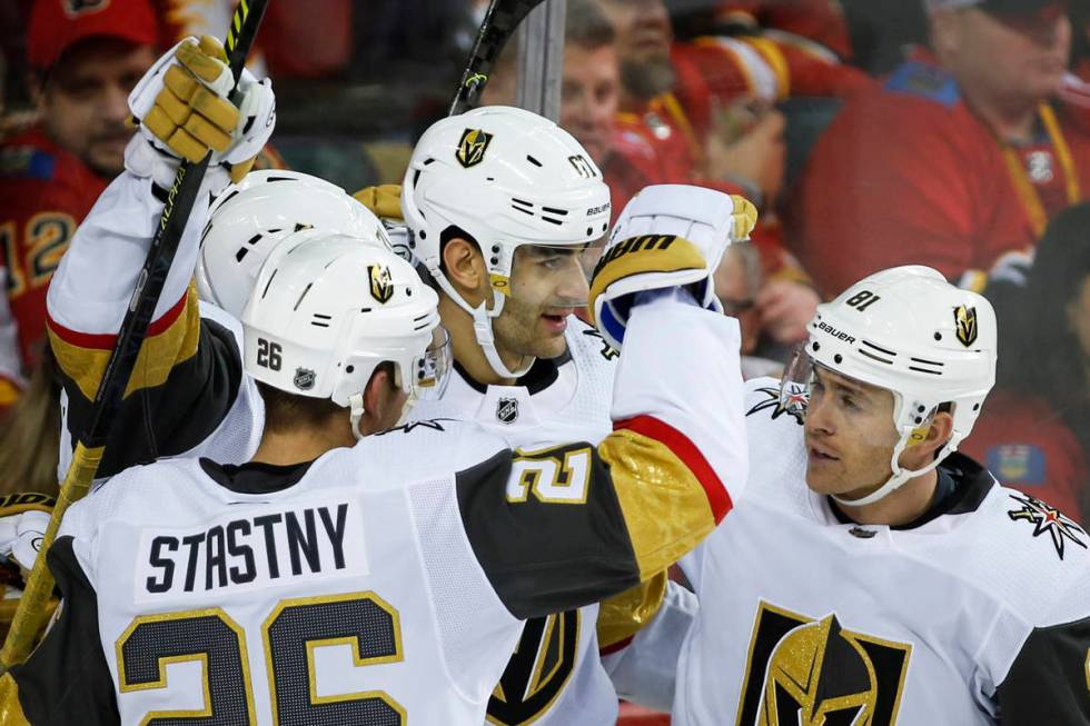 Vegas Golden Knights' Max Pacioretty, center, celebrates his goal with teammates Paul Stastny, ...