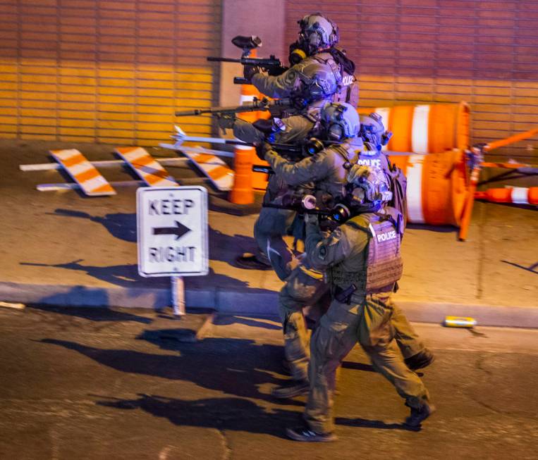 Las Vegas Police fire pepper balls on protesters as they advance on Las Vegas Blvd. as chaos co ...