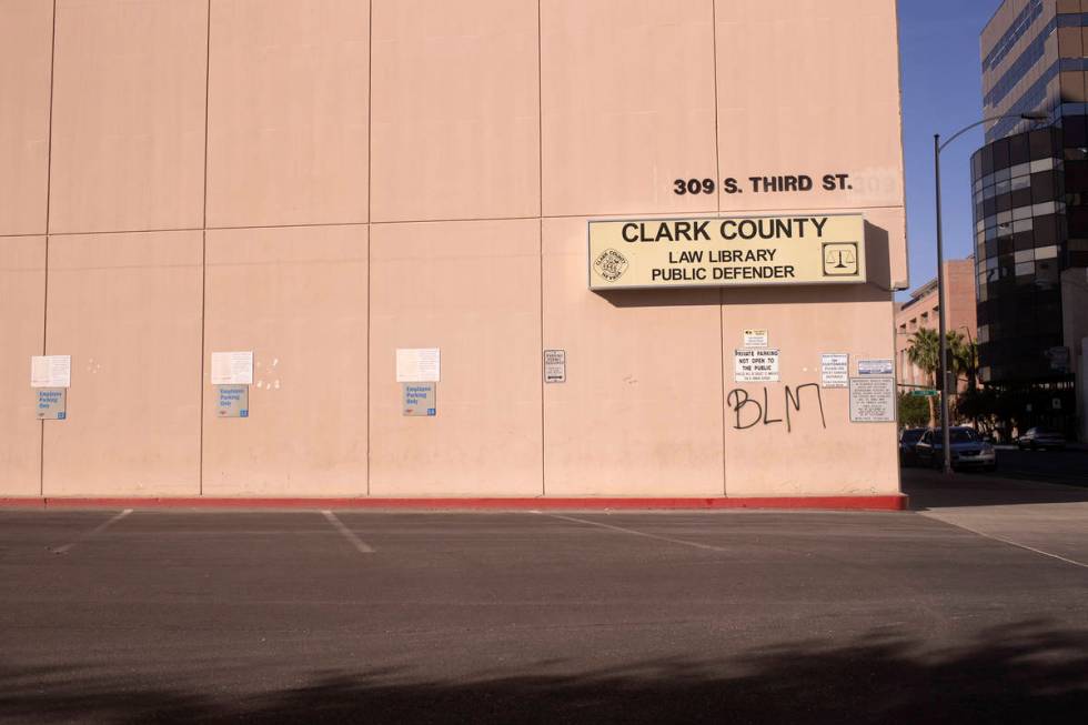 Black Lives Matter graffiti is spray painted on the Clark County Law Library following a night ...