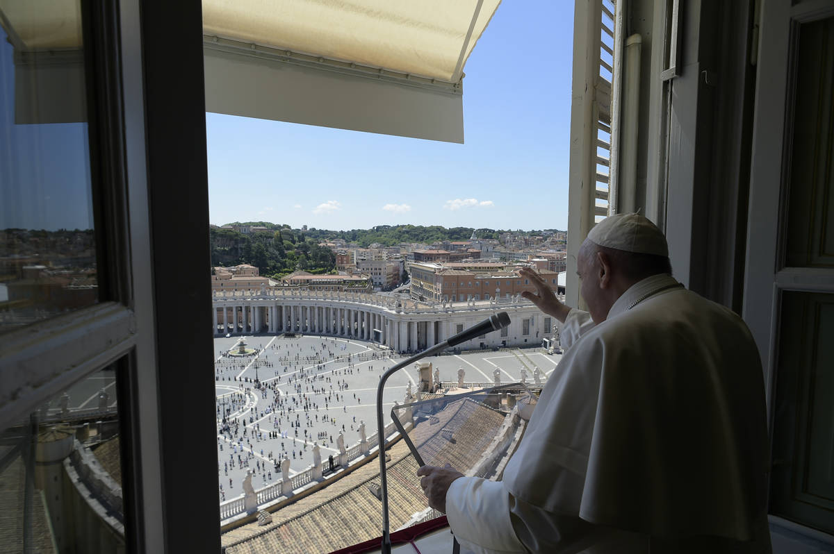 Pope Francis delivers his blessing from his studio window overlooking St. Peter's Square at the ...