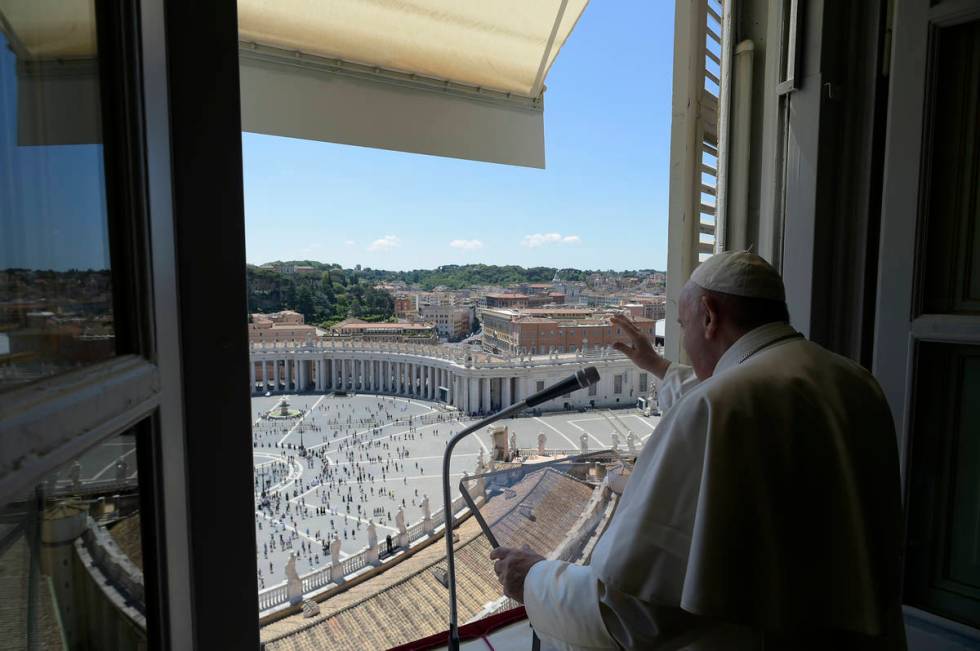 Pope Francis delivers his blessing from his studio window overlooking St. Peter's Square at the ...