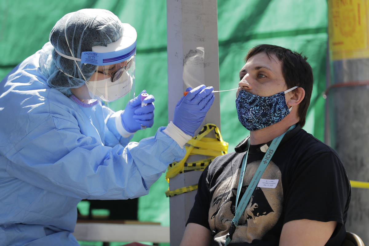 FILE - In this May 16, 2020, file photo, Tina Nguyen, left, a nurse at the International Commun ...