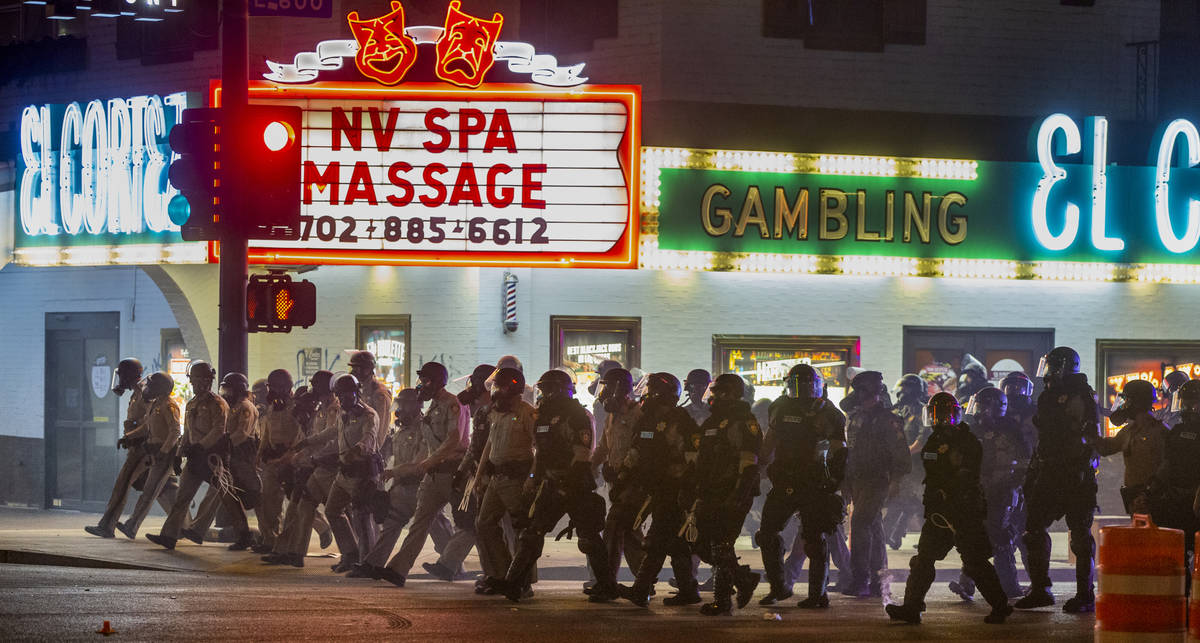 Las Vegas Police advance up Fremont Street on protesters as chaos erupts during a Black Lives M ...