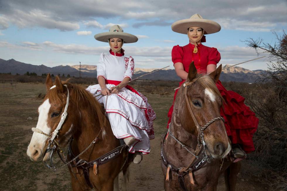 Alondra Colon, left, and her sister Viridiana, pose at Sandy Valley Ranch after a performance. ...