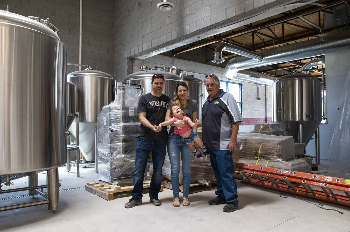 Jason, Lauren and daughter Ariana Taylor with brewmaster Ken Hallyburton at Nevada Brew Works i ...