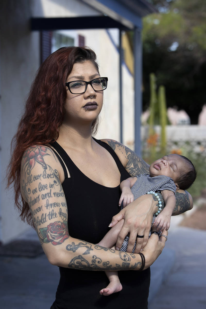 Former Nacho Daddy employee Ariel Gilstrap poses for a portrait with her newborn son, Kane Gils ...