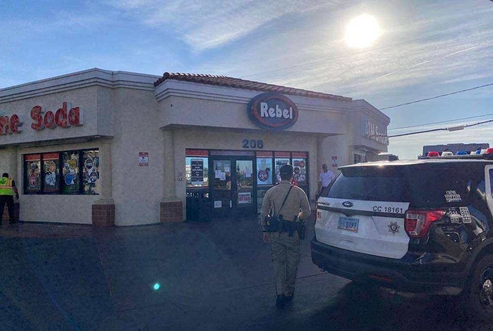 A Las Vegas police officer heads toward a Rebel gas station on Monday, June 1, 2020, at East Tr ...