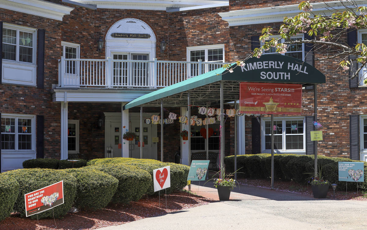 Signs of encouragement for nursing home employees decorate the entrance to the Kimberly Hall So ...