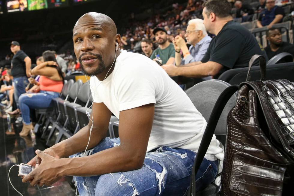 Boxer Floyd Mayweather attends the Las Vegas Aces and Los Angeles Sparks WNBA basketball game a ...