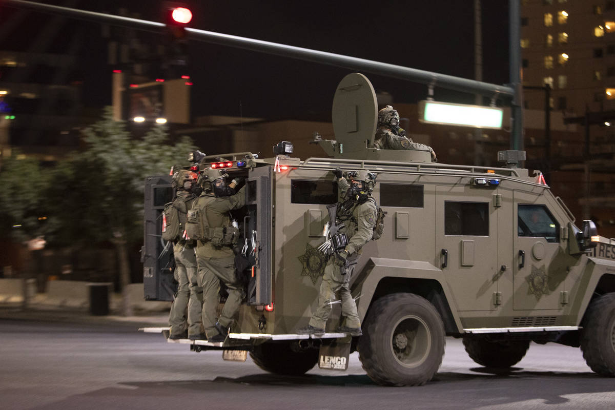 A National Guard truck makes way into downtown as protesters moved from the Strip to Fremont St ...