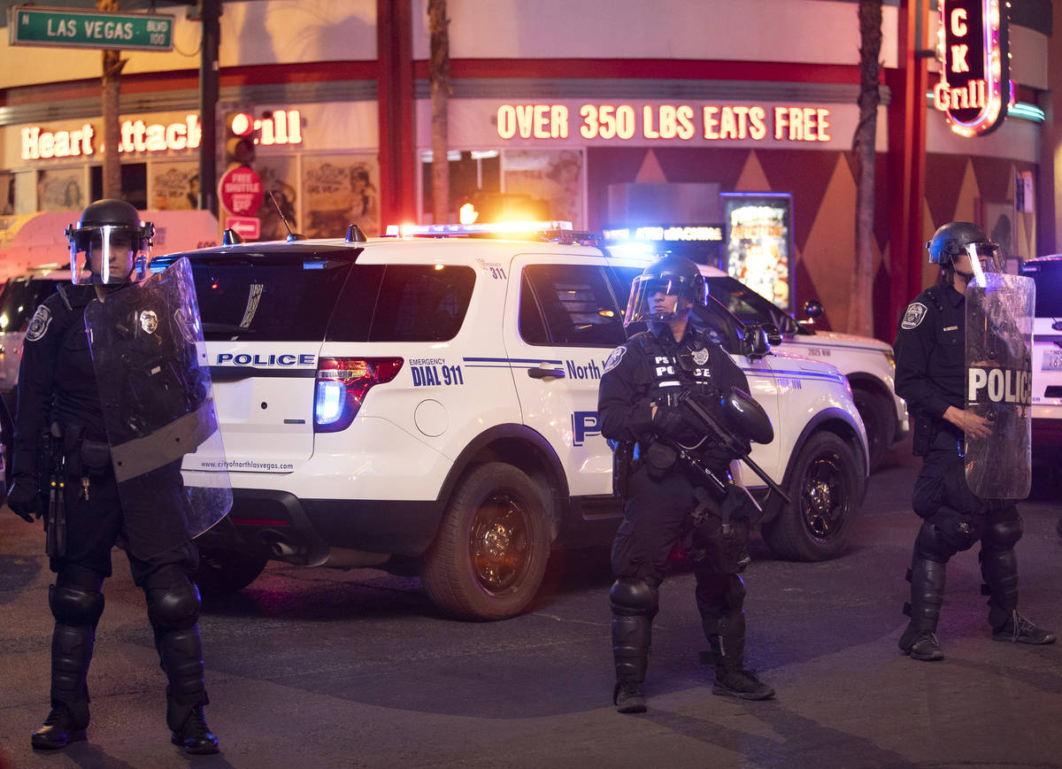 State patrol officers ready themselves to disperse protesters outside of Fremont Street Experie ...