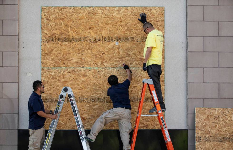 Windows are boarded up at Fashion Show mall in preparation for protests on the Strip on Monday, ...