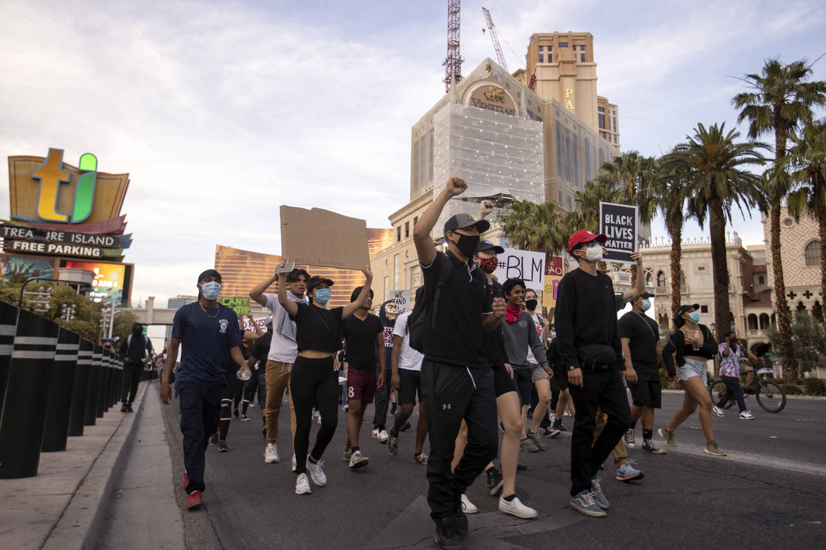 Protestors make way down Las Vegas Boulevard in support of George Floyd, who was killed in cust ...