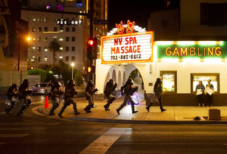 Police race down Fremont Street during a protest organized by Black Lives Matter in downtown La ...