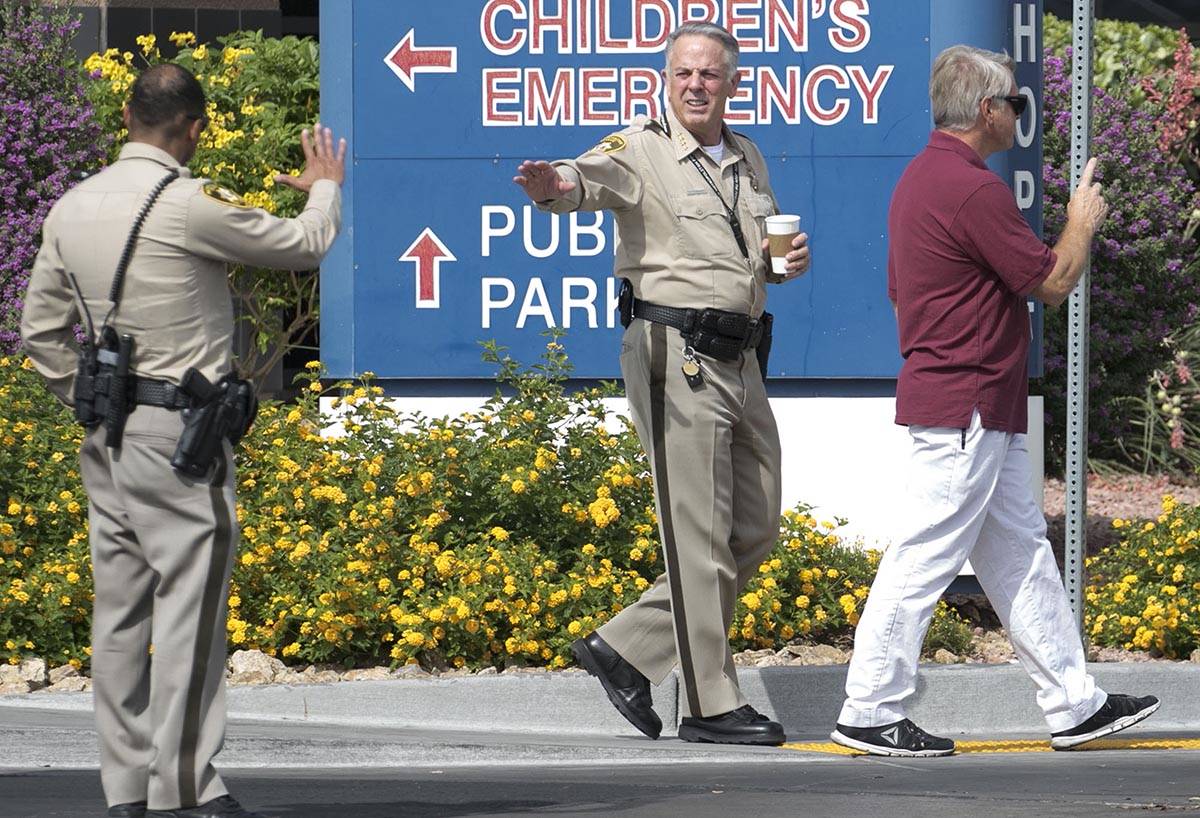 Clark County Sheriff Joe Lombardo waves to an officer as he leaves University Medical Center on ...