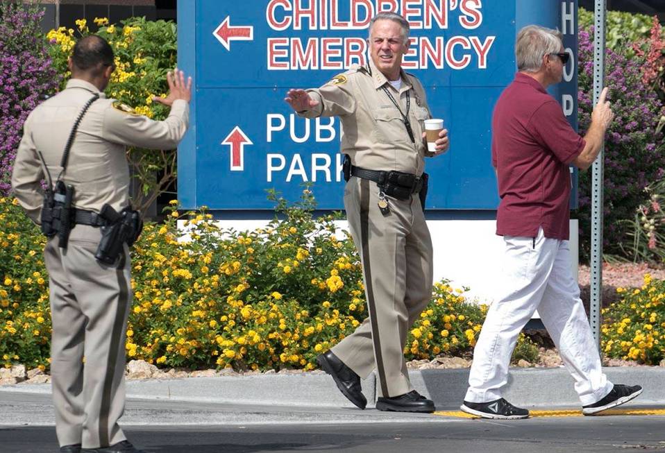 Clark County Sheriff Joe Lombardo waves to an officer as he leaves University Medical Center on ...