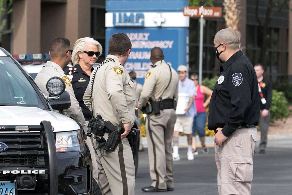 Las Vegas police officers gather outside University Medical Center on Tuesday, June 2, 2020. A ...