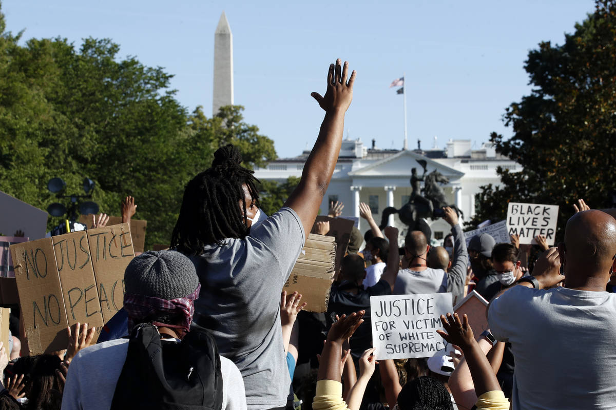 Demonstrators gather in Lafayette Park to protest the death of George Floyd, Monday, June 1, 20 ...