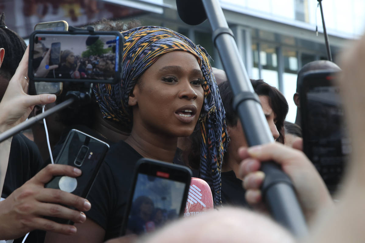 Assa Traore, sister of Adama Traore, answers reporters outside the Palace of Justice Tuesday, J ...