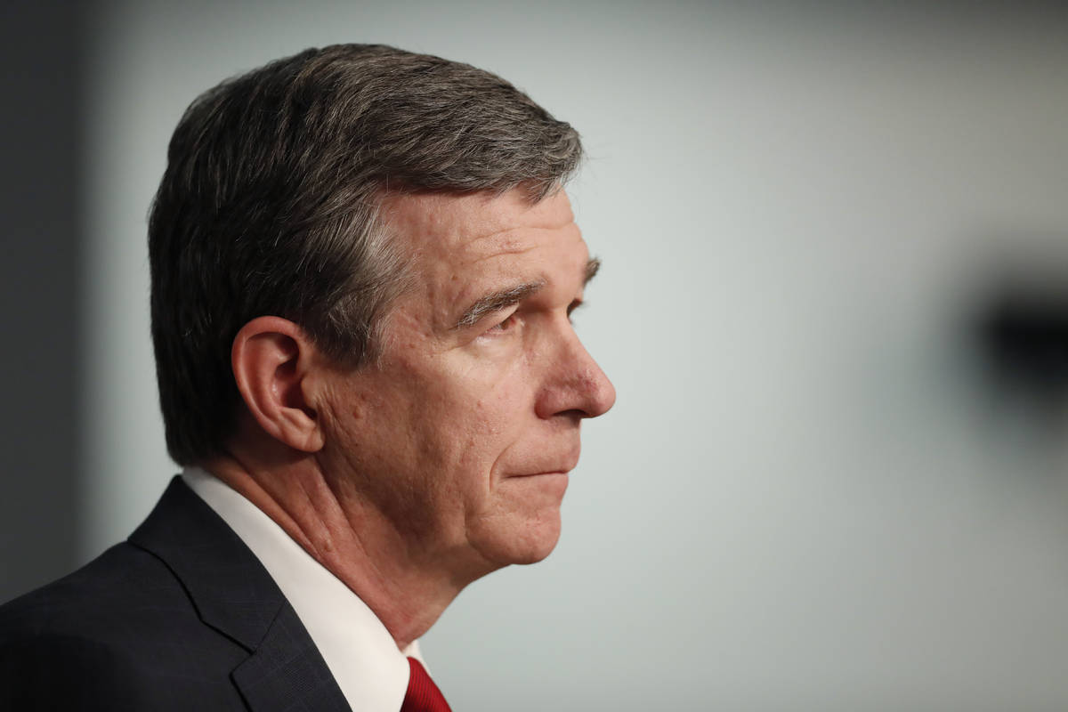North Carolina Gov. Roy Cooper speaks during a briefing at the Emergency Operations Center in R ...