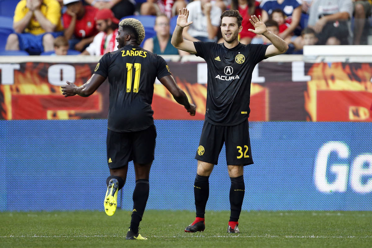 Columbus Crews' Patrick Mullins (32) celebrates scoring a goal with Crew forward Gyasi Zerdes ( ...