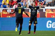 Columbus Crews' Patrick Mullins (32) celebrates scoring a goal with Crew forward Gyasi Zerdes ( ...