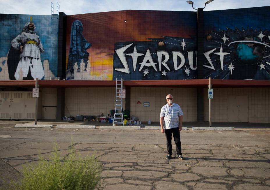 Artist James Stanford stands in front of his mural, “From the Land Beyond Beyond,&#x201d ...