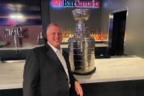 The D Las Vegas co-owner Derek Stevens poses with a replica Stanley Cup at BarCanada on Wednesd ...
