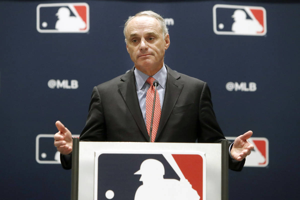 In this Nov. 21, 2019, file photo, baseball commissioner Rob Manfred speaks to the media at the ...