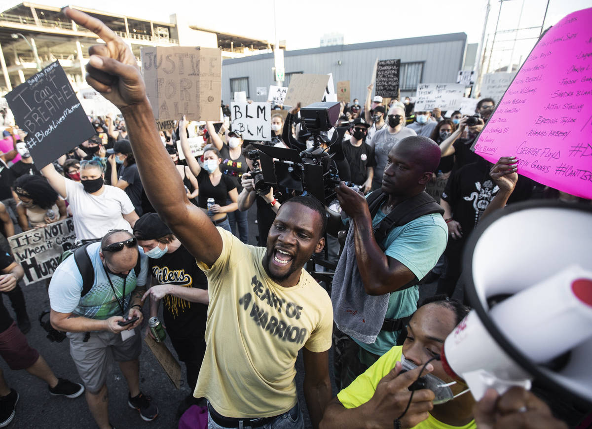 A crowd of at least 300 people protest outside Las Vegas City Hall on Wednesday, June 3, 2020, ...