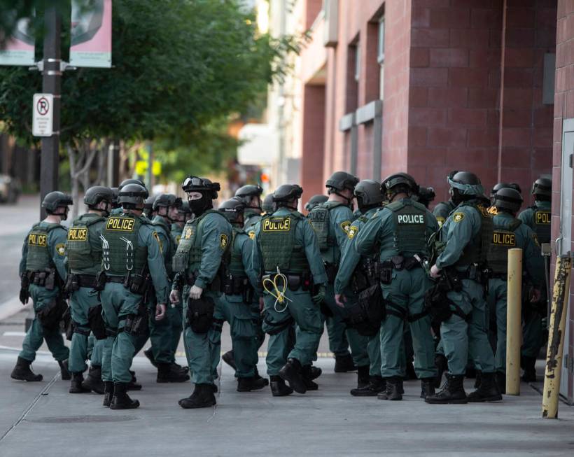 Police officers mobilize in downtown Las Vegas on Wednesday, June 3, 2020, as protests continue ...