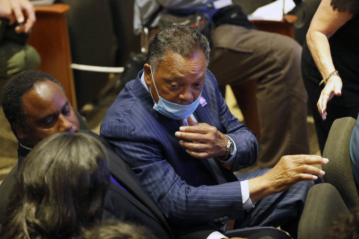 The Rev. Jesse Jackson talks with others in at North Central University Thursday, June 4, 2020, ...