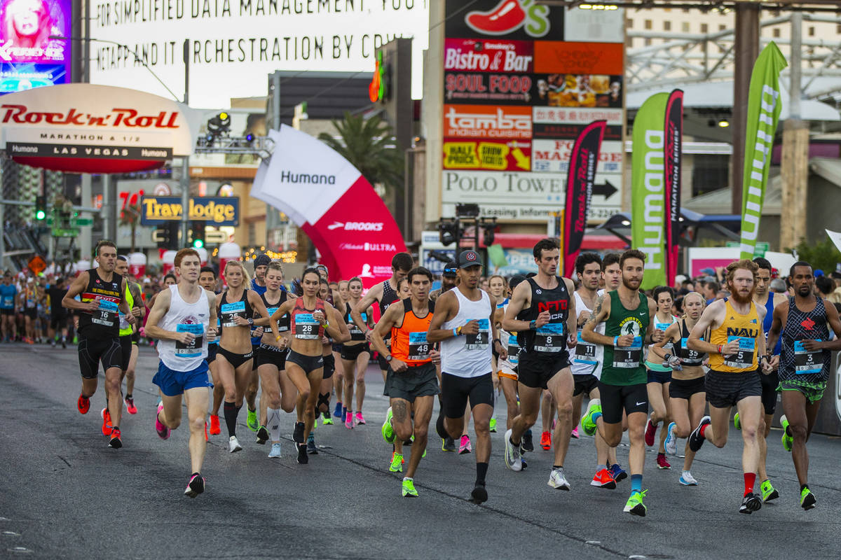 Elite runners leave the starting line during the Las Vegas Rock 'n' Roll Marathon along the Str ...