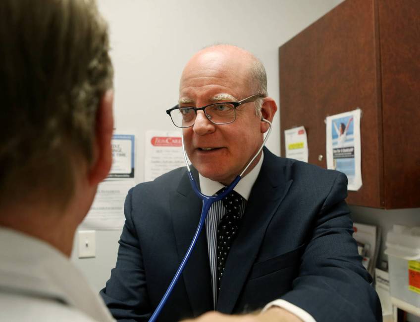 Internist Dr. Ivan Goldsmith works with a patient at his Las Vegas office,Thursday, May 31, 201 ...