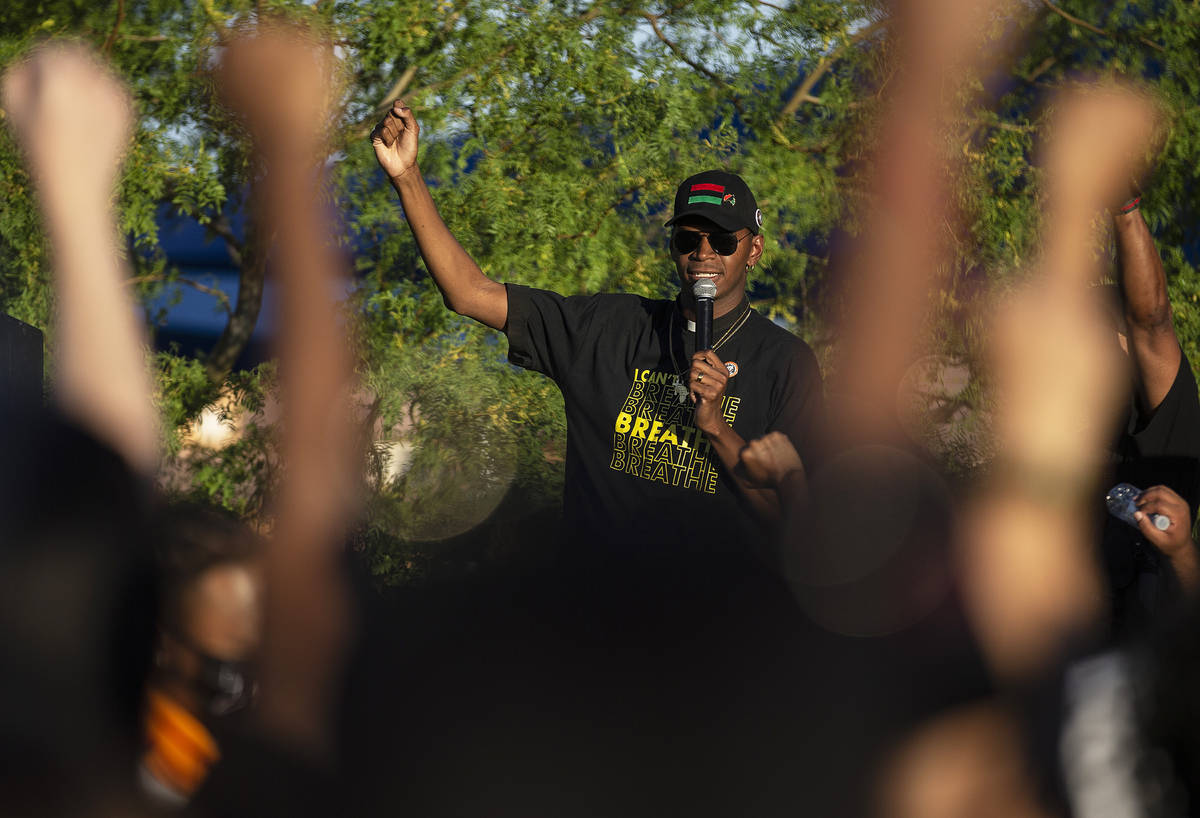 Rev. Stretch Sanders sings "We Shall Overcome" with thousands of people who showed up ...