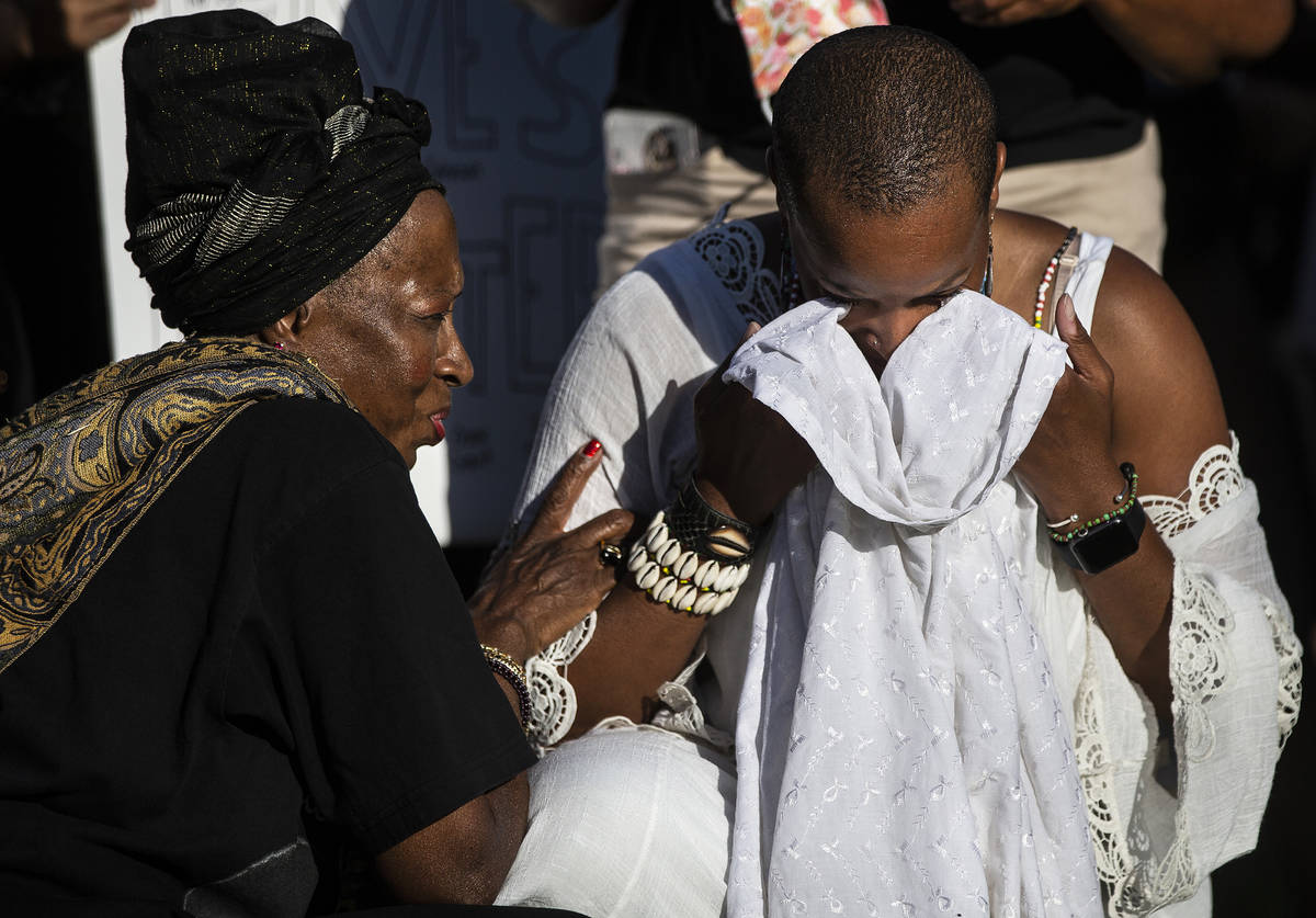 Nicole Palacio, right, is comforted by Alicent Kwateng during at a Black Lives Matter event at ...