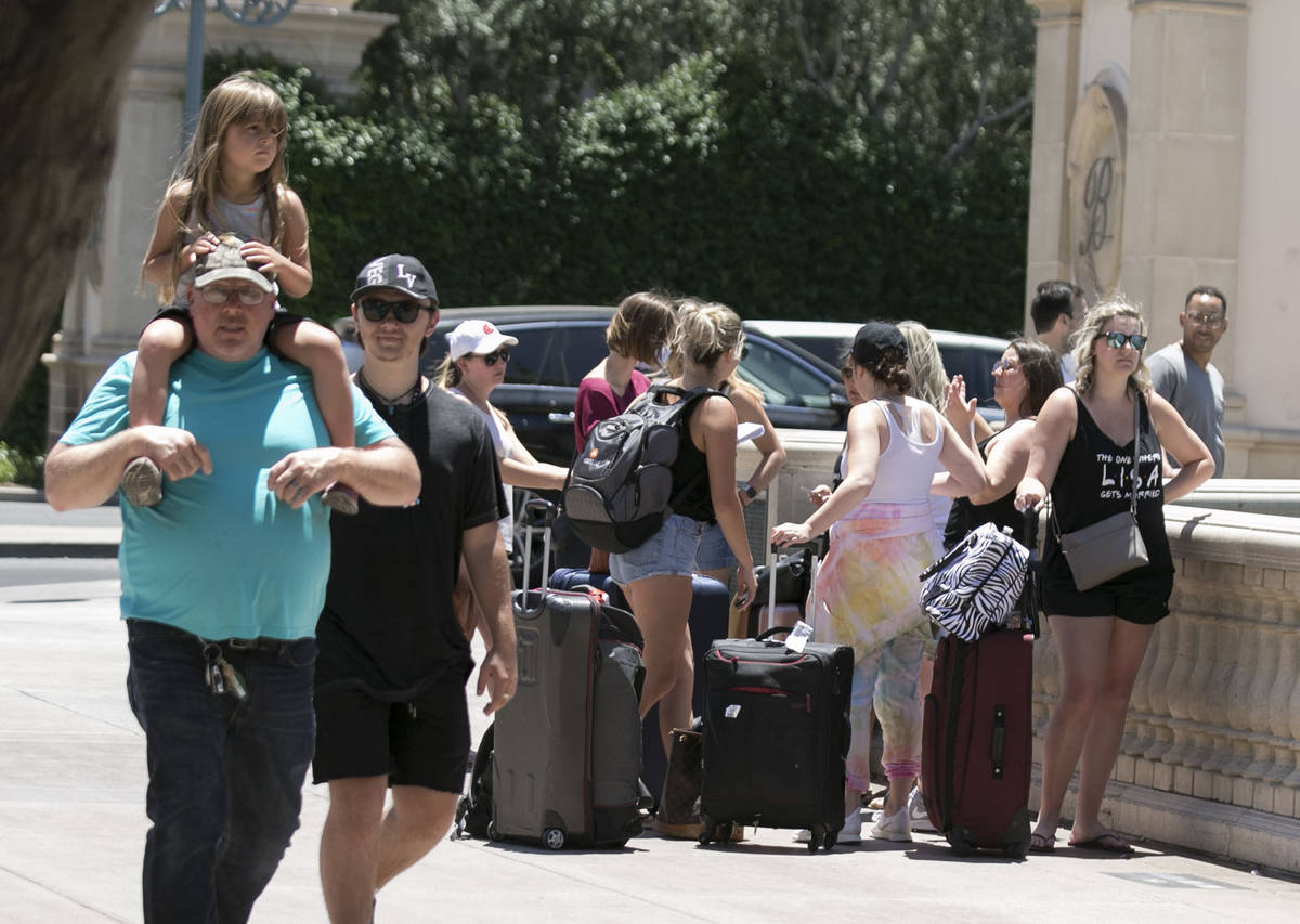 Tourists gather at the Bellagio fountain on Sunday, June 7, 2020, in Las Vegas. On Sunday, both ...